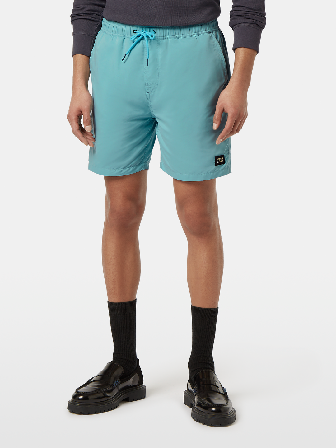 Solid mid-length swim shorts