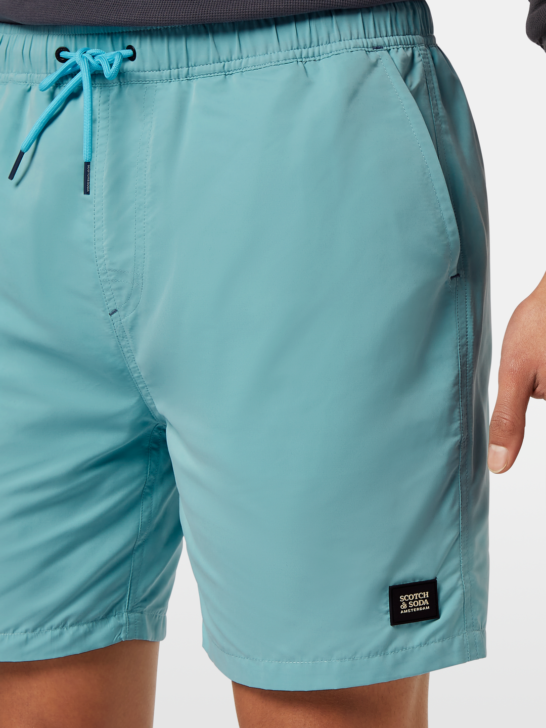 Solid mid-length swim shorts